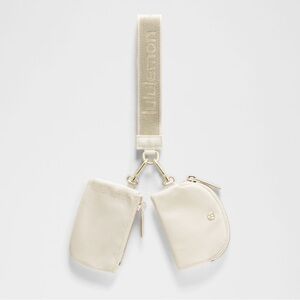 Lululemon Wristlet Dual Pouch Set light ivory metallic wordmark